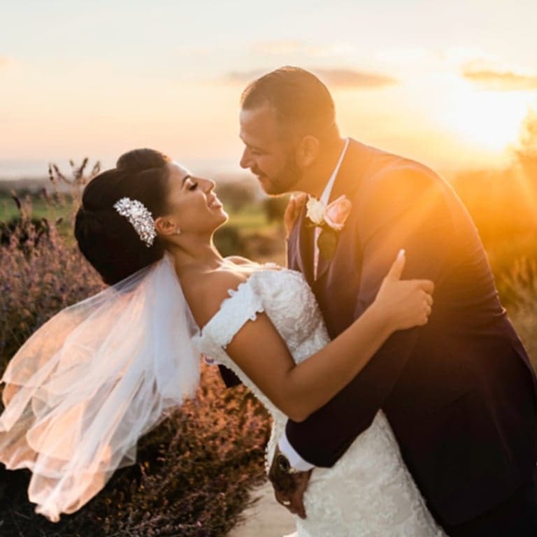 Couple toasting at sunset — Cyprus destination wedding
