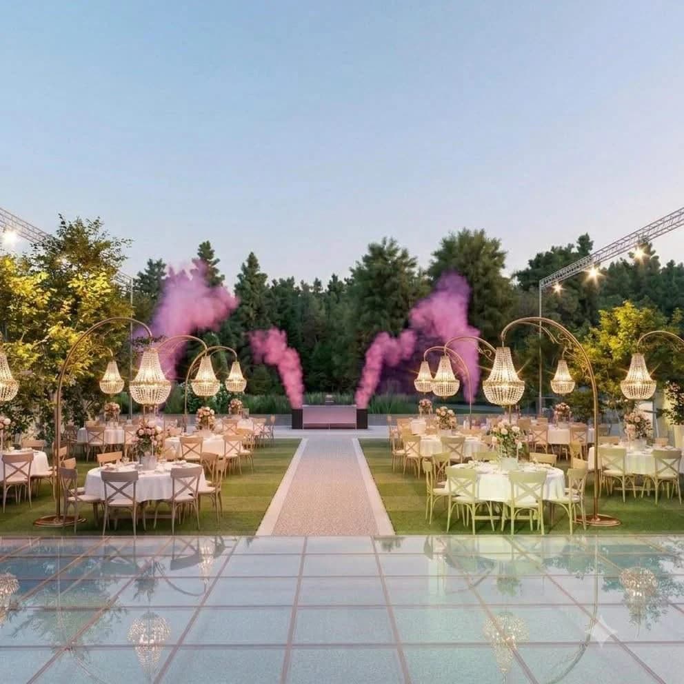 Illustrative outdoor reception design with dining tables, hanging lights and an evening celebration space