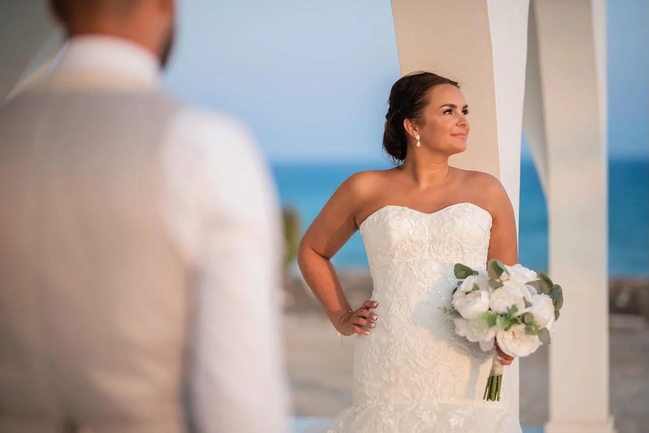 Bride beneath the seaside chapel arches at Agia Thekla