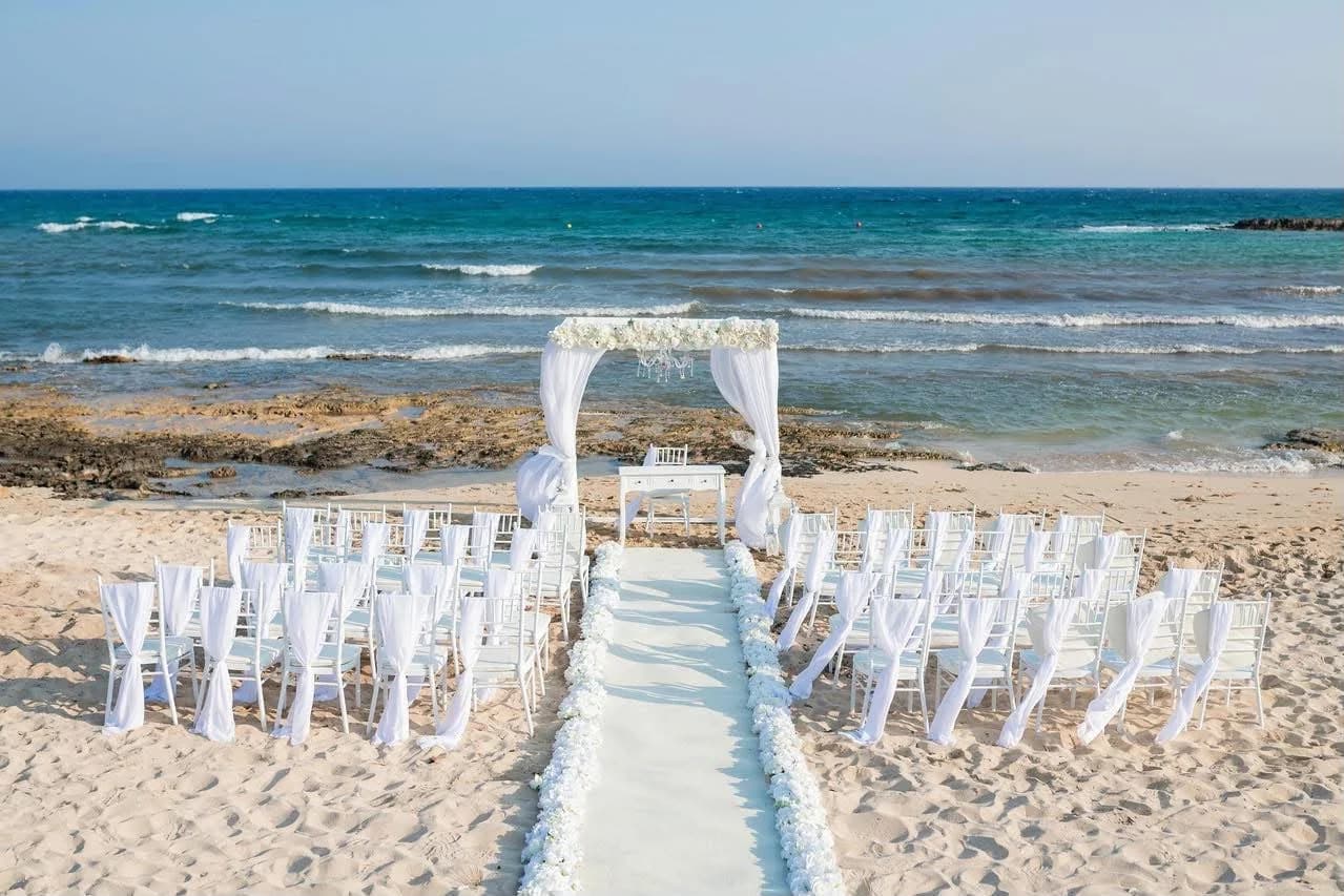 Beach ceremony aisle and chairs at Agia Thekla