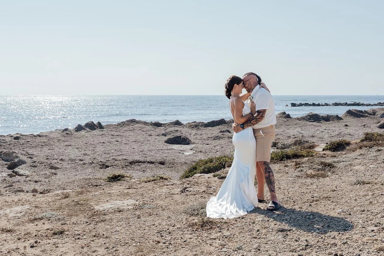 Couple beside the sea at Faros Lighthouse Beach