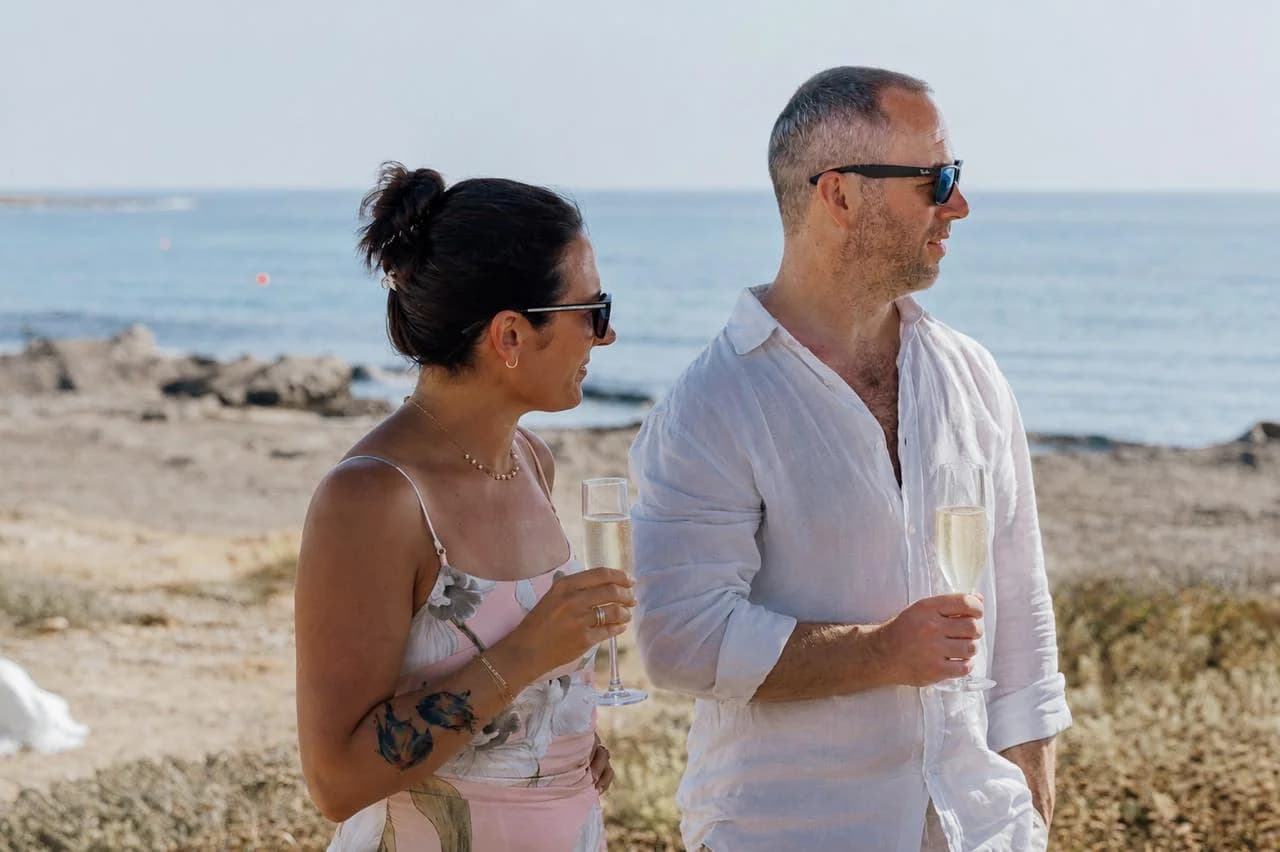 Couple during a beach ceremony at Faros Lighthouse Beach