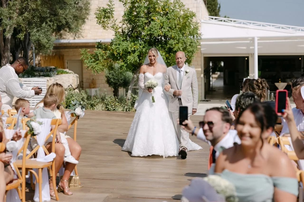 Wedding guests outside at Paliomonastiros