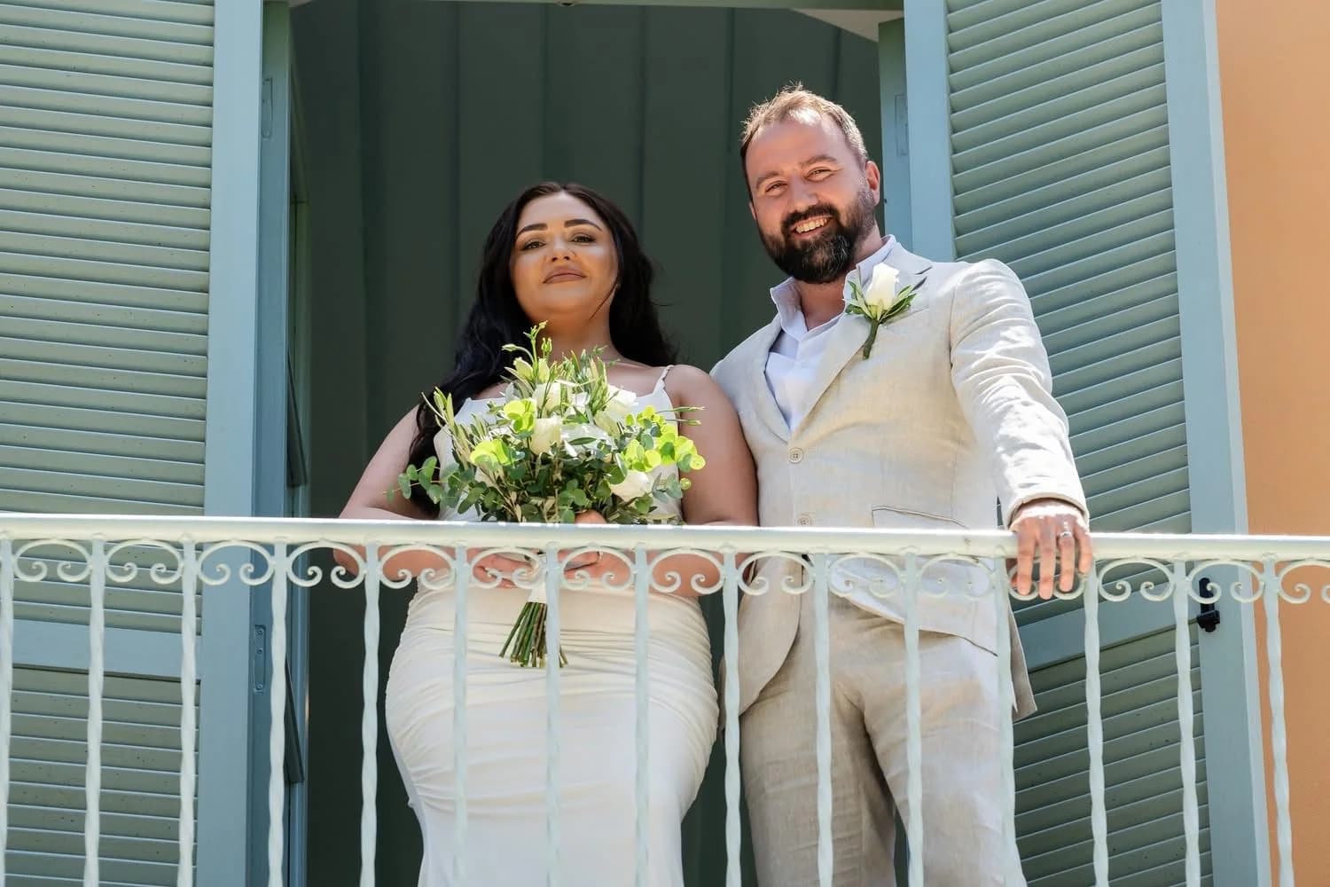Newly married couple on the gallery balcony