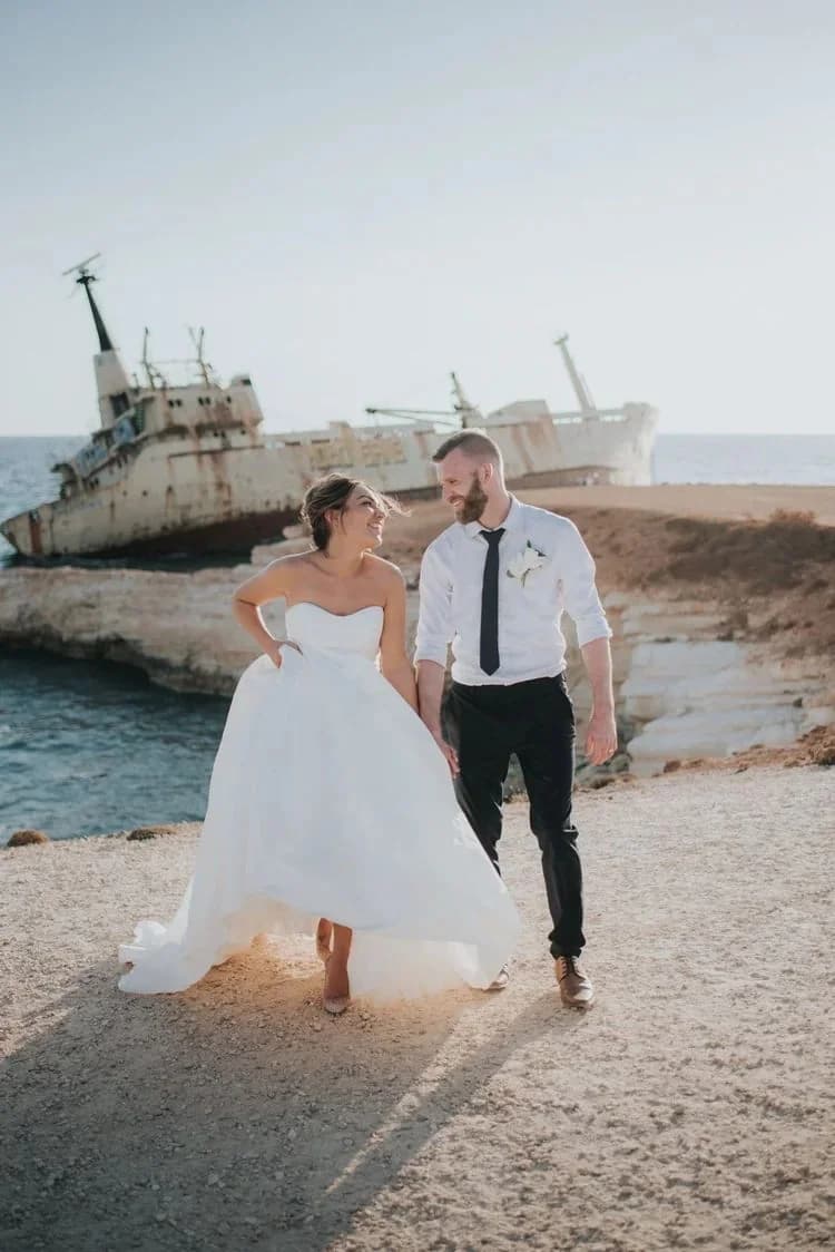 Couple on the rocky shore at Shipwreck