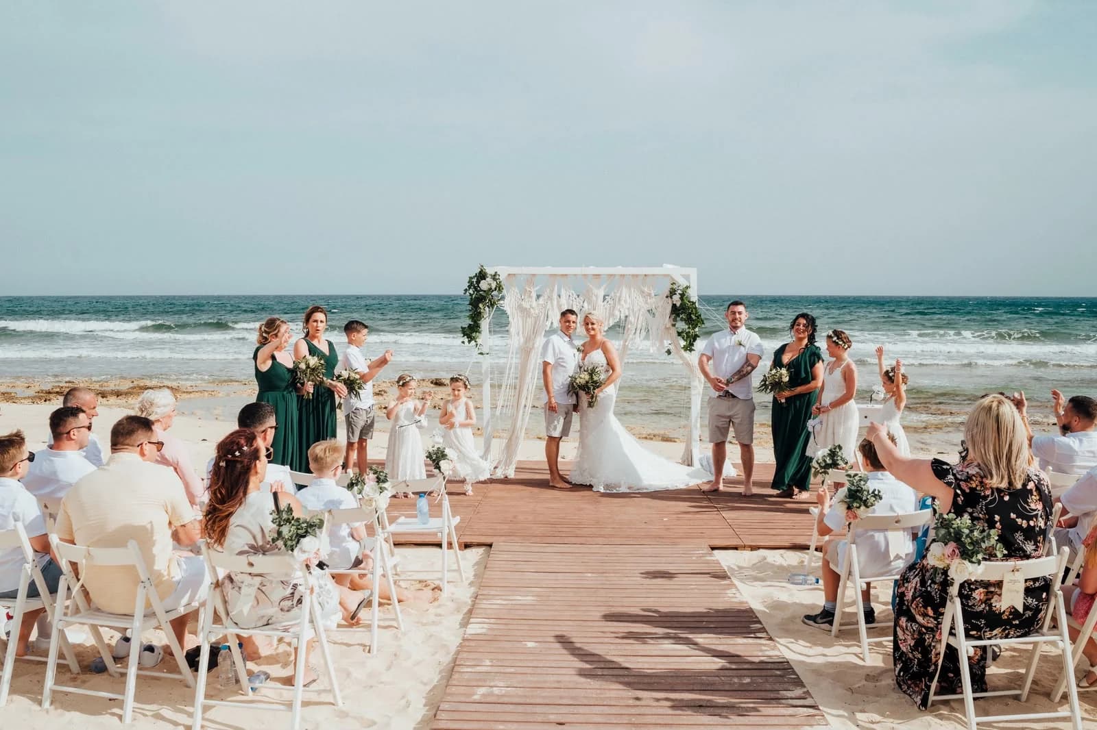 Beach ceremony and guests at Sirenes Beach