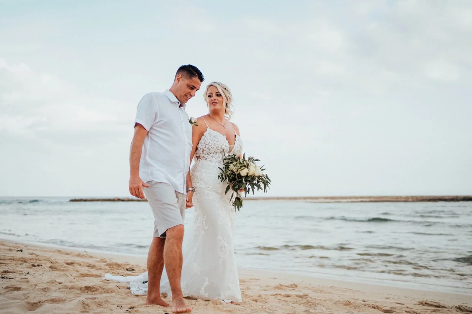 Couple beside the sea at Sirenes Beach