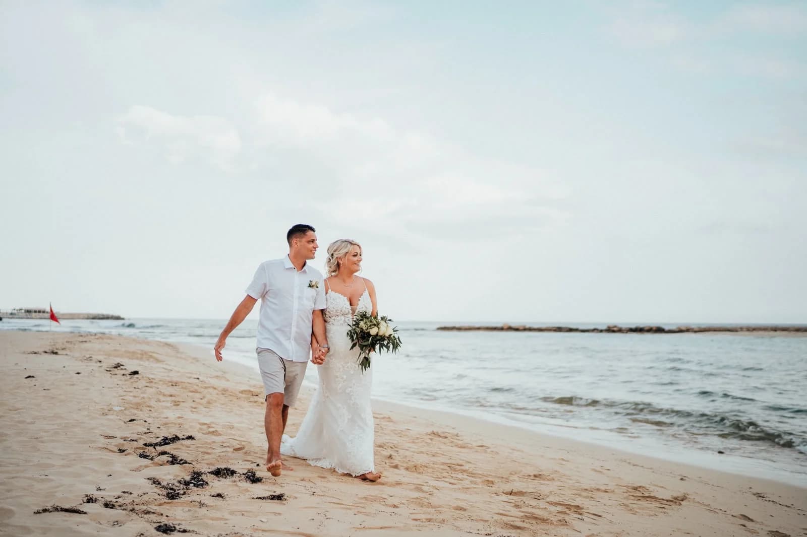 Couple on the beach at Sirenes Beach